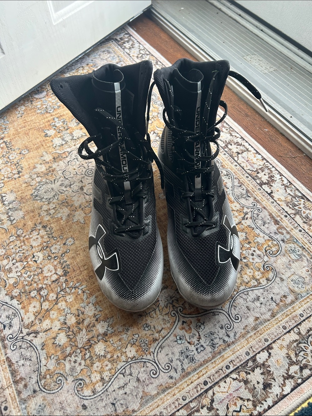 Under Armour Black and Silver High-Top Athletic cleats